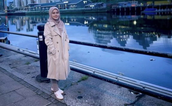 Nurul Tanwir, Information Systems and Operations PhD student at Newcastle University Business School, stood on the quayside in Newcastle upon Tyne